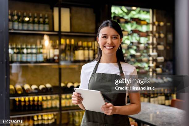 happy waitress working at a restaurant - apron stockfoto's en -beelden