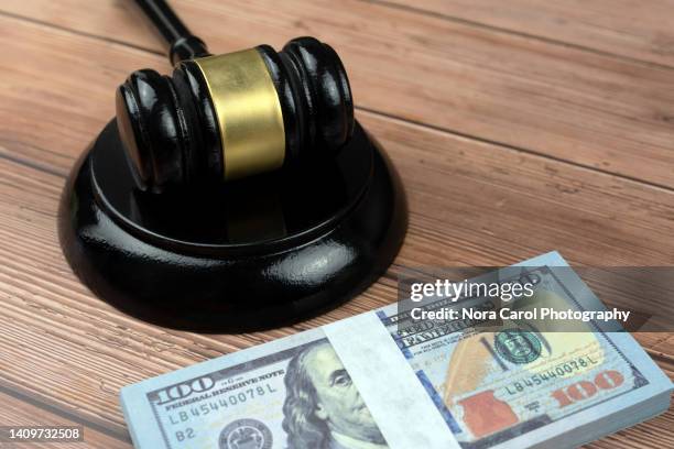 black gavel and block with hundred dollar bills - money penalty stock pictures, royalty-free photos & images