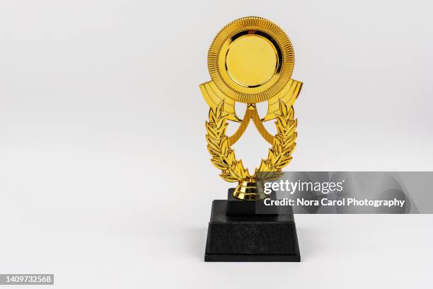 golden trophy on white background - trophy stock-fotos und bilder