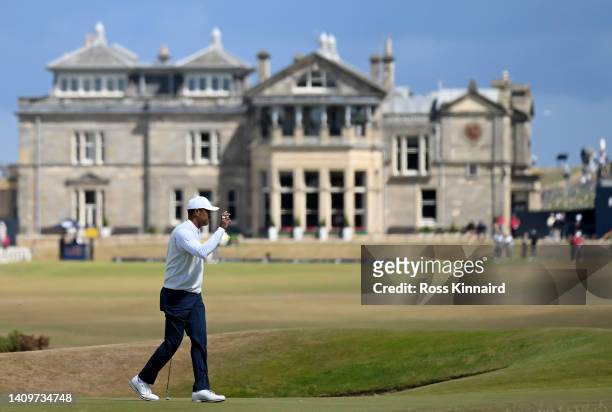 Tiger Woods of the United States acknowledges the crowds after putting on the 17th green during Day Two of The 150th Open at St Andrews Old Course on...