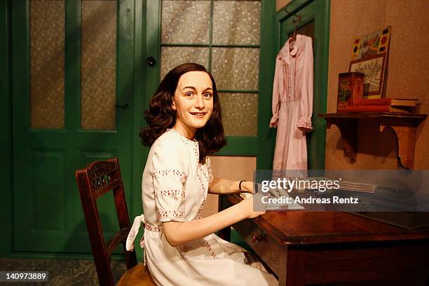 Wax figure of Anne Frank and their hideout reconstruction is unveiled at Madame Tussauds on March 9, 2012 in Berlin, Germany.