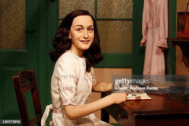 Wax figure of Anne Frank and their hideout reconstruction is unveiled at Madame Tussauds on March 9, 2012 in Berlin, Germany.