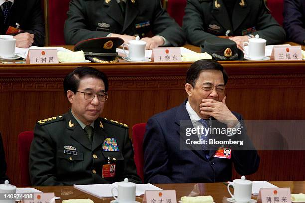 Xu Caihou, vice chairman of China's Central Military Commission, left, and Bo Xilai, Chinese Communist Party secretary of Chongqing, attend a plenary...