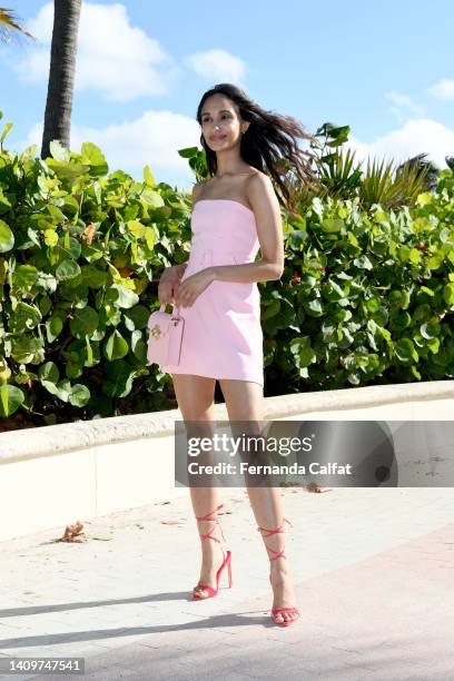 Influencer Laura Arumugam wearing Amanda Uprichard and bag Bee2Bee Honey Bag during Miami Swim Week on July 15, 2022 in Miami, Florida.