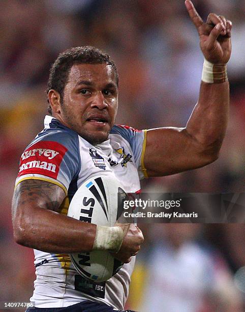 Matthew Bowen of the Cowboys celebrates as he scores the match winning try in the final seconds of the match during the round two NRL match between...