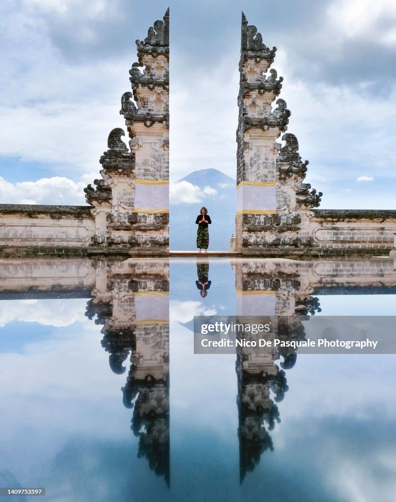 Man Praying At Lempuyang Temple Gate, Bali, Indonesia