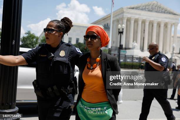 Rep. Ilhan Omar is detained by U.S. Capitol Police Officers after participating in a sit in with activists from Center for Popular Democracy Action...
