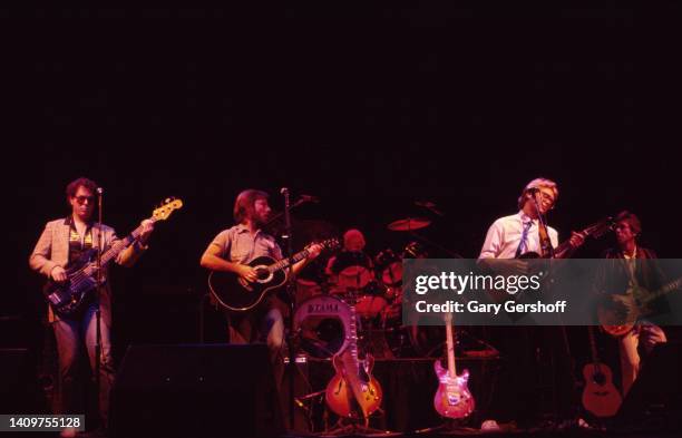 View of Pop musicians Dewey Bunnell , on acoustic guitar, and Gerry Beckley , on acoustic guitar, both of the group America, as they perform onstage...