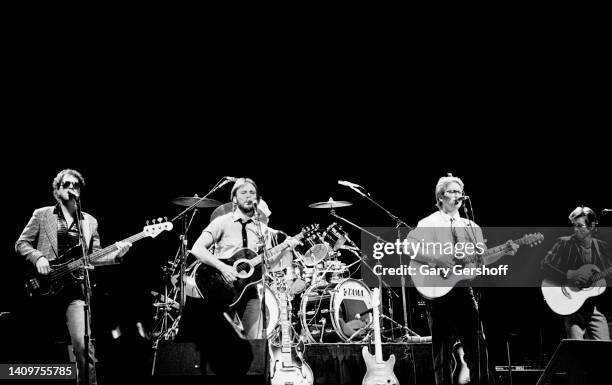 View of Pop musicians Dewey Bunnell , on acoustic guitar, and Gerry Beckley , on acoustic guitar, both of the group America, as they perform onstage...