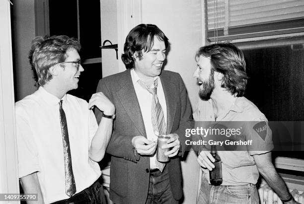 View of Pop musicians Gerry Beckley and Dewey Bunnell , both of the group America, as they pose with composer & musician Jimmy Webb backstage at...