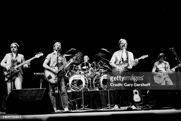 View of Pop musicians Dewey Bunnell , on electric guitar, and Gerry Beckley , on electric guitar, both of the group America, as they perform onstage...
