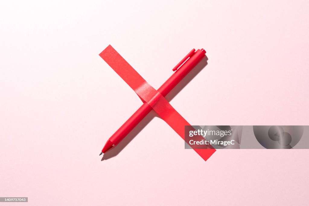 Red Cross Sign Consists of a Pen Covered with Tape, Censorship