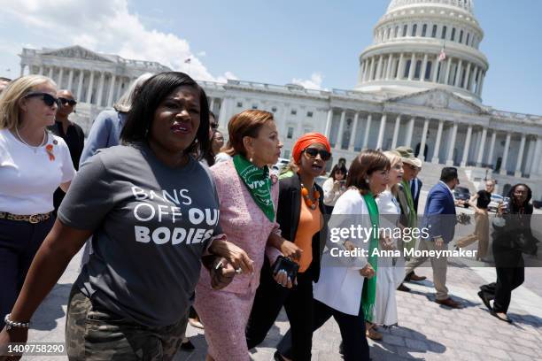 Rep. Cori Bush , Rep. Nydia Velazquez , Rep. Ilhan Omar , Rep. Jackie Speier , and Rep. Carolyn Maloney , walk from the U.S. Capitol Building to join...