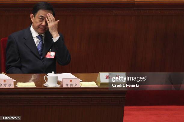 China's Chongqing Municipality Communist Party Secretary Bo Xilai attends the third plenary meeting of the National People's Congress at The Great...