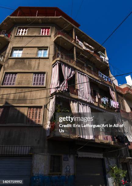 Old heritage building with curtains in the city, Beirut Governorate, Beirut, Lebanon on June 5, 2022 in Beirut, Lebanon.