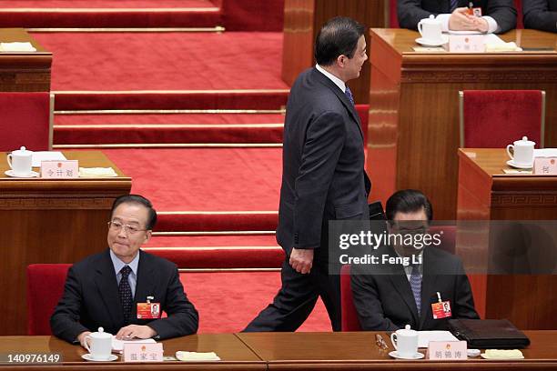 China's Chongqing Municipality Communist Party Secretary Bo Xilai walks as he arrives for the third plenary meeting of the National People's Congress...