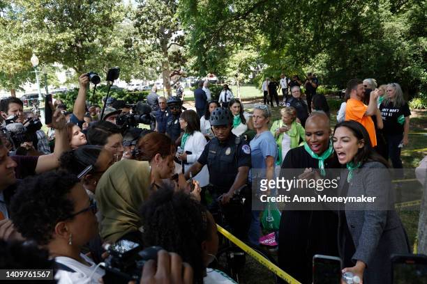 Rep. Ayanna Pressley and Rep. Alexandria Ocasio-Cortez speak to reporters after being arrested alongside activists from Center for Popular Democracy...