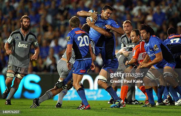 Cameron Shepherd of the Force gets tackled during the round three Super Rugby match between the Western Force and the Hurricanes at nib Stadium on...