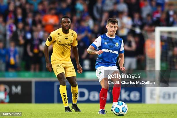 Jordan Stewart of Linfield is challenged by Brice Wembangomo of Bodo/Glimt during the UEFA Champions League Second Qualifying Round First Leg match...