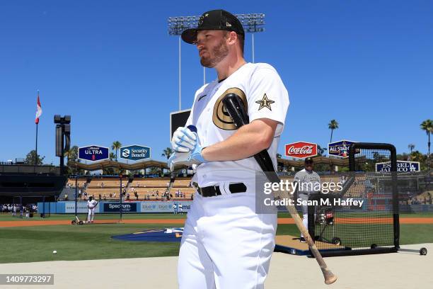 Ian Happ of the Chicago Cubs looks on during batting practice ahead of the 92nd MLB All-Star Game presented by Mastercard at Dodger Stadium on July...