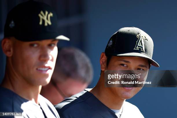 Aaron Judge of the New York Yankees and Shohei Ohtani of the Los Angeles Angels look on from the dugout before the 92nd MLB All-Star Game presented...