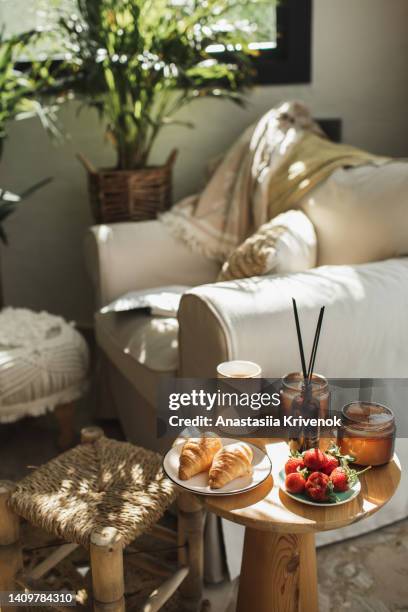book with cup of coffee and croissants on wooden table. - aromatherapy diffuser stock pictures, royalty-free photos & images