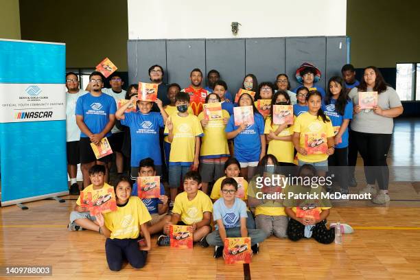 Bubba Wallace poses for a photo with members of the Union League Boys & Girls Club in promotion of the NASCAR Chicago Street Race announcement on...