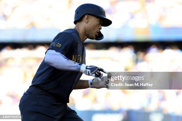 Giancarlo Stanton of the New York Yankees rounds the bases after hitting a two RBI home run against the National League in the fourth inningduring...