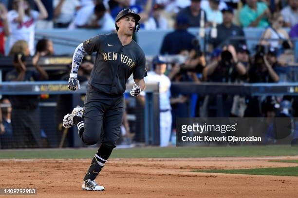 Giancarlo Stanton of the New York Yankees rounds the bases after hitting a two RBI home run against the National League in the fourth inningduring...