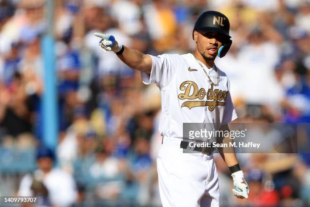 Mookie Betts of the Los Angeles Dodgers celebrates after hitting an RBI single against the American League in the first inning during the 92nd MLB...