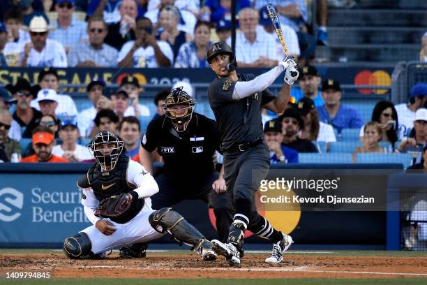 Giancarlo Stanton of the New York Yankees follows the ball after hitting a two RBI home run against the National League in the fourth inning during...