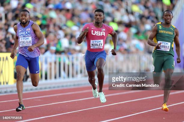 Nethaneel Mitchell-Blake of Team Great Britain, Fred Kerley of Team United States, and Sinesipho Dambile of Team South Africa compete in the Men's...