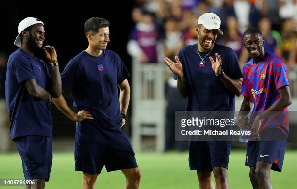 Franck Kessie, Robert Lewandowski, Pierre-Emerick Aubameyang and Ousmane Dembele of FC Barcelona react after a preseason friendly against Inter Miami...