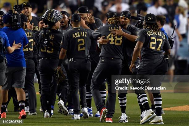 Members of the American League celebrate their 3-2 win over the National League during the 92nd MLB All-Star Game presented by Mastercard at Dodger...