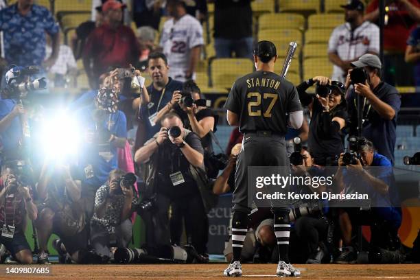 Giancarlo Stanton of the New York Yankees holds up the Ted Williams MVP Award after the American League defeated the National League 3-2 during the...