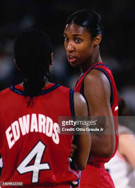 Lisa Leslie, Center for the United States women's basketball team talks with team mate Teresa Edwards during the Pre Olympic basketball game against...
