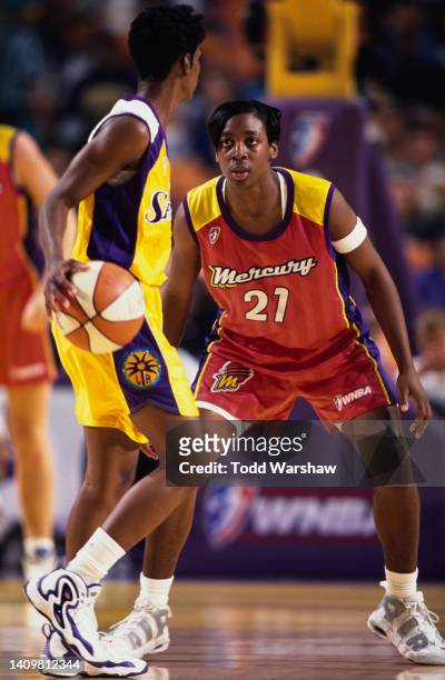 Umeki Webb, Forward and Guard for the Phoenix Mercury keeps her eyes on Penny Toler of the Los Angeles Sparks during their WNBA Western Conference...