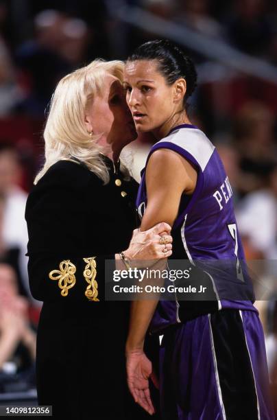 Ticha Penicheiro from Portugal and Guard for the Sacramento Monarchs listens to instructions from coach Maura McHugh during the WNBA Western...