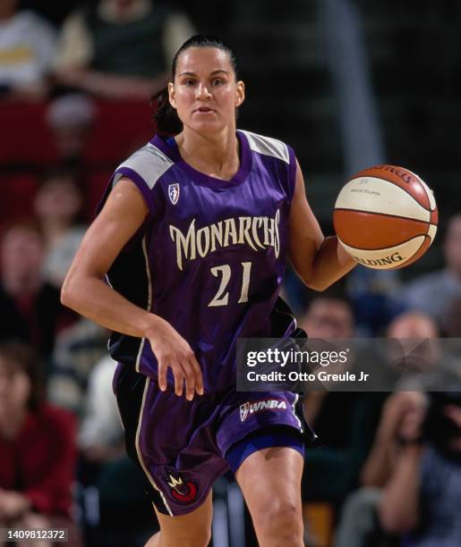 Ticha Penicheiro from Portugal and Guard for the Sacramento Monarchs dribbles the basketball during the WNBA Western Conference basketball game...