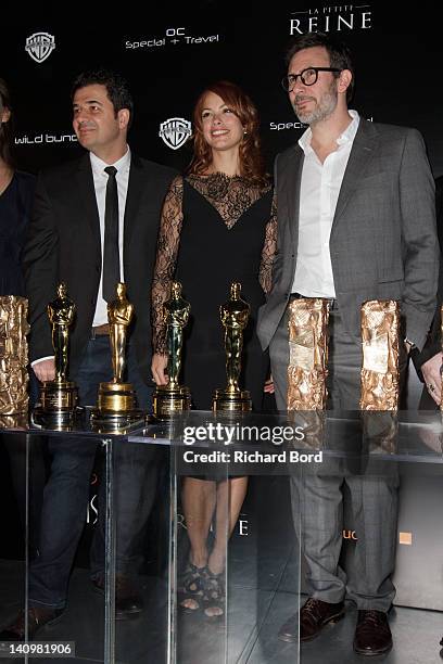 Composer Ludovic Bource, actress Berenice Bejo and director Michel Hazanavicius pose with "The Artist" awards during "The Artist" Post-Awards...