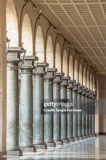 colonnade covered walkway in a street - colonnade stock pictures, royalty-free photos & images