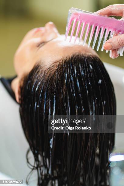 close up hair treatment on wet hair in beauty salon - hair mask stock pictures, royalty-free photos & images