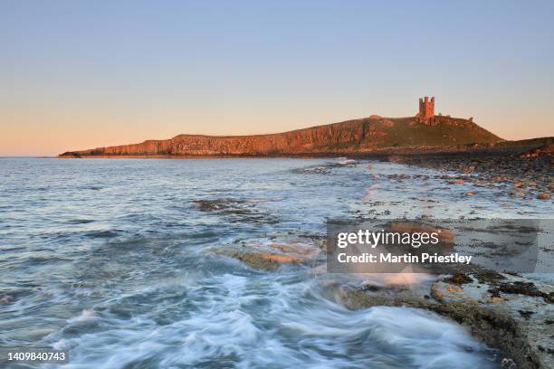 dunstanburgh castle, northumberland, uk - northumberland stock pictures, royalty-free photos & images