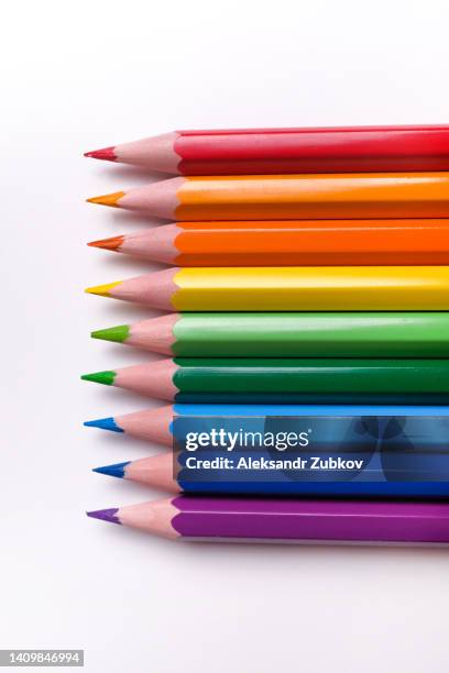 bright colored pencils on a white table or background. the concept of preschool and school education, hobbies. the colors of the rainbow. - colored pencil stockfoto's en -beelden