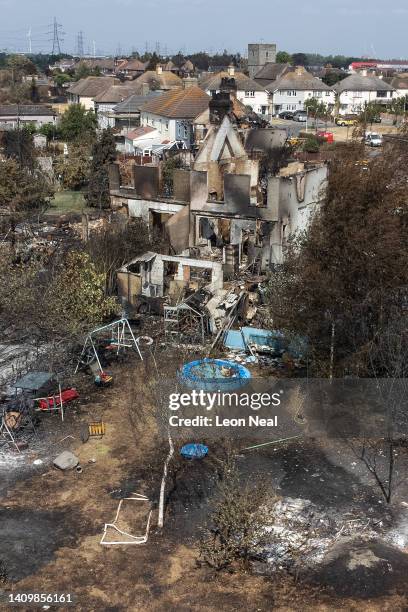 An aerial view shows a Union Flag flying among the the rubble and destruction in a residential area, following a large blaze the previous day, on...