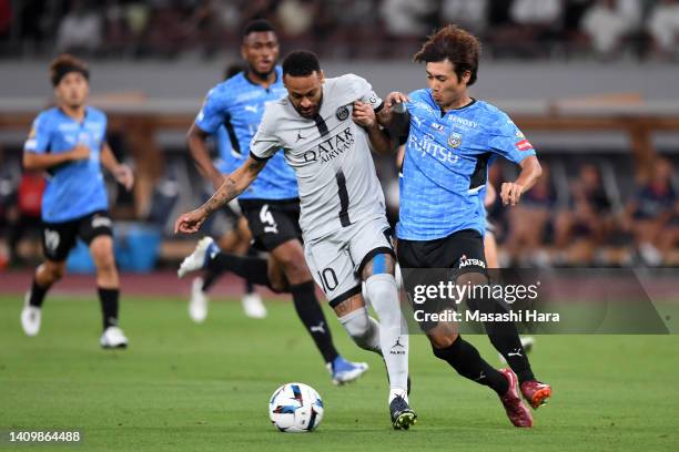 Neymar Jr of Paris Saint-Germain controls the ball under pressure of Shintaro Kurumaya of Kawasaki Frontale during the preseason friendly match...