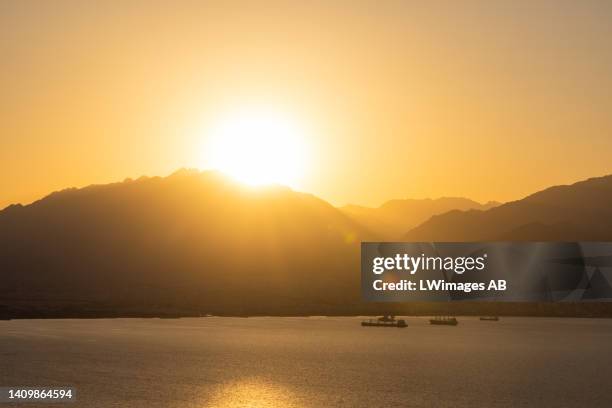 Sunrise over the Gulf of Aqaba on July 18 in Eilat, Israel. Coral reefs are complete ecosystems, and although the coral reef in Eilat may be capable...