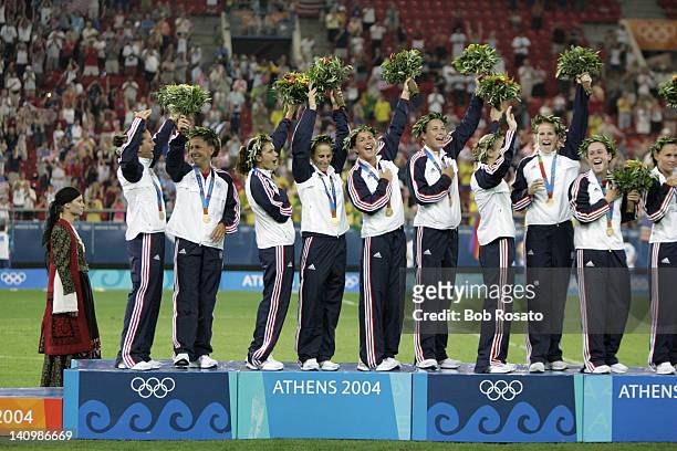 Summer Olympics: L-R: USA Julie Foudy , Joy Fawcett , Mia Hamm , Kristine Lilly , Brandi Chastain , and Abby Wambach victorious on medal stand after...