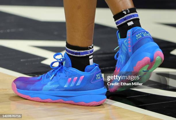 Chelsea Gray of the Las Vegas Aces wears Adidas Dame 8 Battle of the Bubble shoes as she warms up before a game against the Atlanta Dream at Michelob...