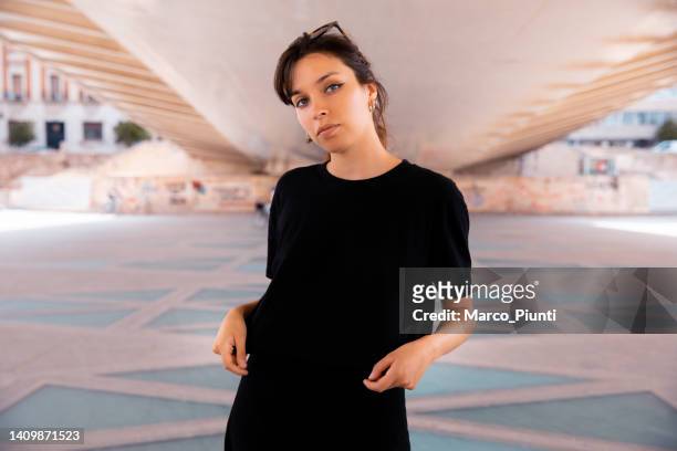 young woman wearing black t-shirt - tee mockup stock pictures, royalty-free photos & images